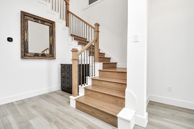 staircase featuring hardwood / wood-style flooring