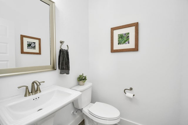 bathroom with sink and toilet