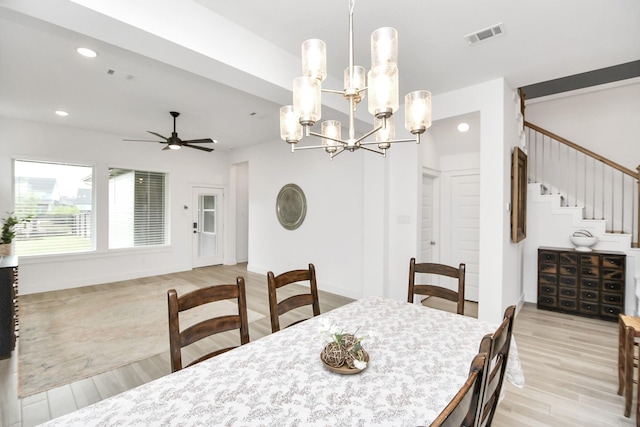 dining area featuring ceiling fan and light wood-type flooring