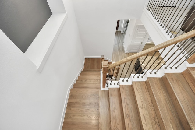 stairs featuring wood-type flooring