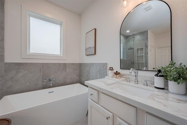 bathroom with vanity and plus walk in shower