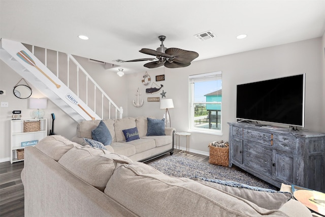 living room featuring dark hardwood / wood-style floors and ceiling fan