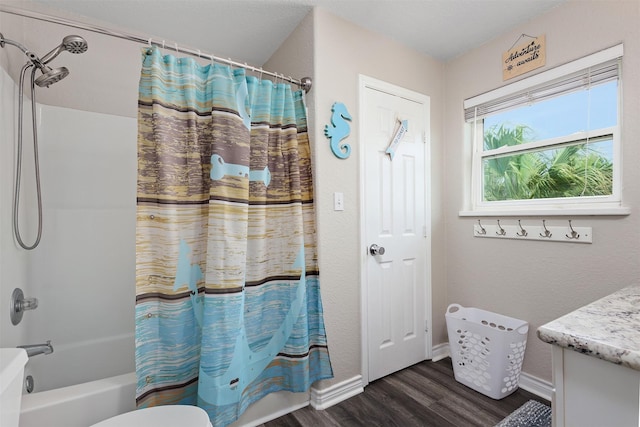 bathroom with vanity, hardwood / wood-style floors, and shower / bath combination with curtain