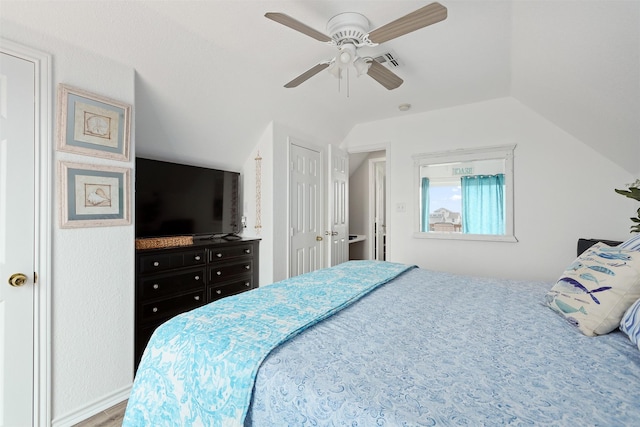 bedroom featuring ceiling fan and vaulted ceiling