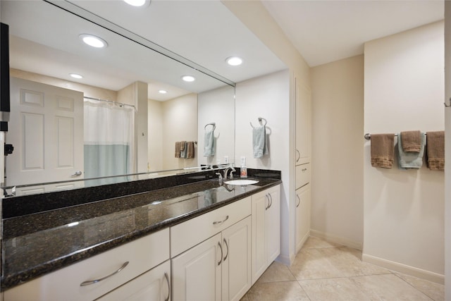 bathroom with vanity and tile patterned floors