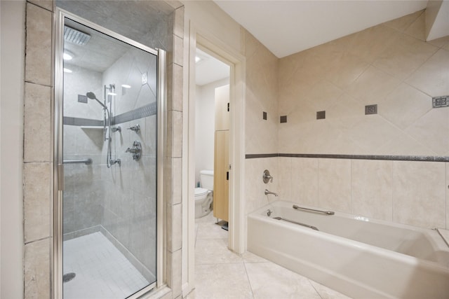 bathroom with tile patterned flooring, independent shower and bath, and toilet