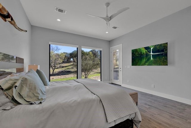 bedroom featuring access to exterior, wood-type flooring, and ceiling fan