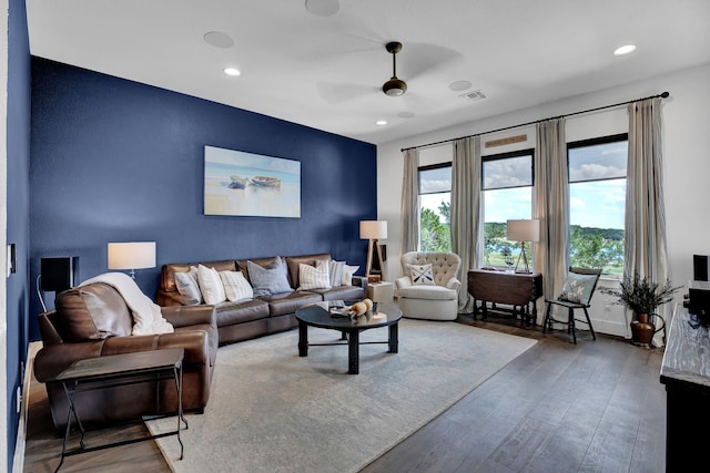 living room with hardwood / wood-style floors and ceiling fan