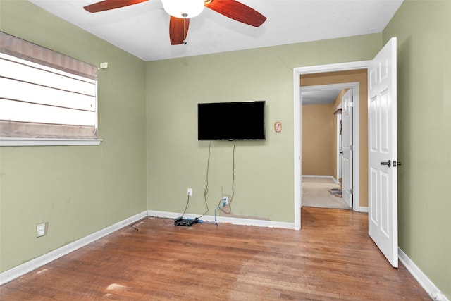 interior space featuring hardwood / wood-style flooring and ceiling fan