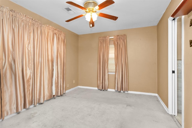 carpeted empty room with ceiling fan