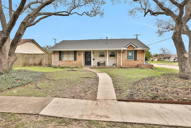 single story home featuring a front lawn