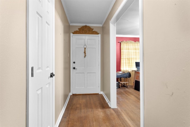 interior space with light hardwood / wood-style flooring and ornamental molding