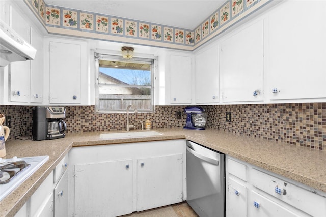 kitchen with white cabinetry, dishwasher, sink, and tasteful backsplash