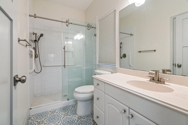 bathroom featuring vanity, an enclosed shower, tile patterned floors, and toilet