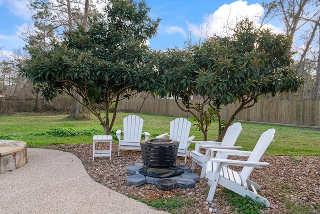 view of yard featuring a fire pit and a patio area