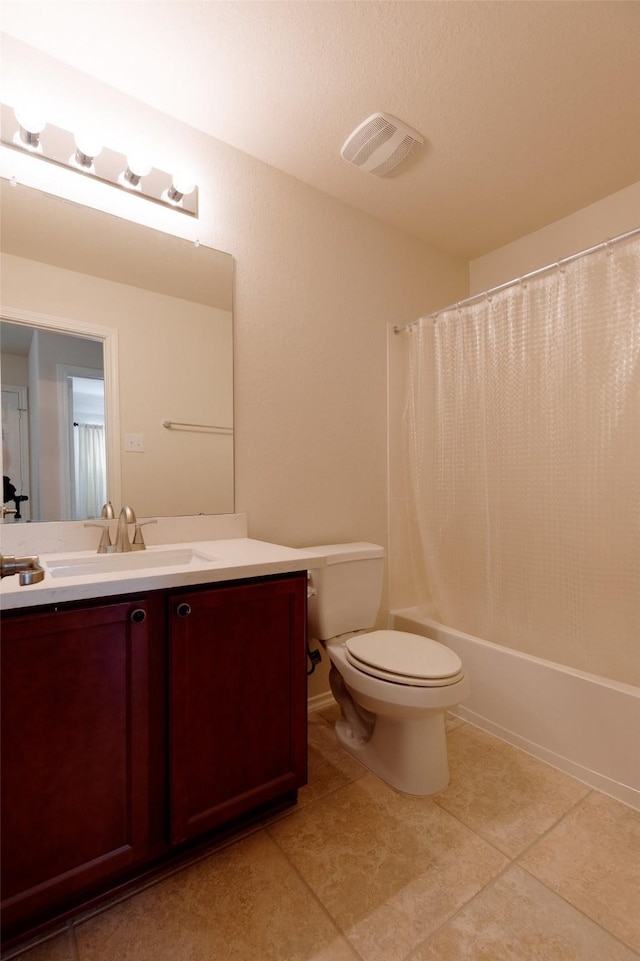 bathroom with visible vents, toilet, shower / bath combo with shower curtain, tile patterned floors, and vanity