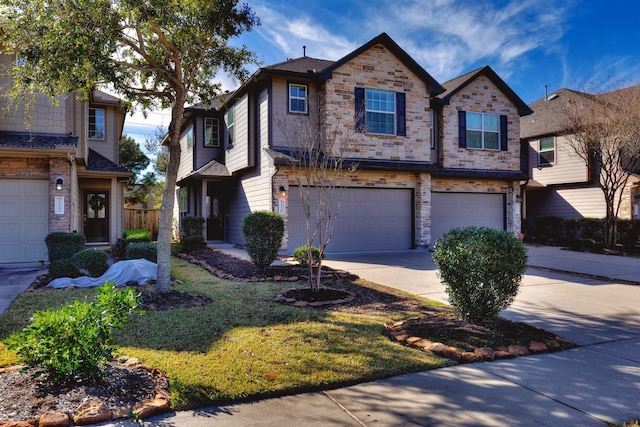 view of front of home featuring concrete driveway, an attached garage, and stone siding