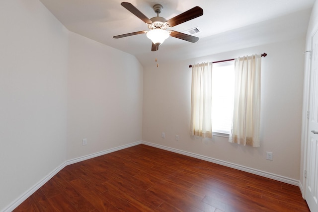 unfurnished room featuring visible vents, baseboards, and wood finished floors