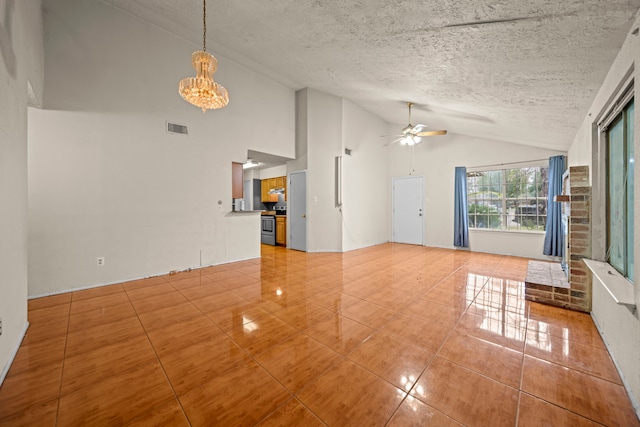 unfurnished living room with lofted ceiling, ceiling fan with notable chandelier, tile patterned floors, and a textured ceiling