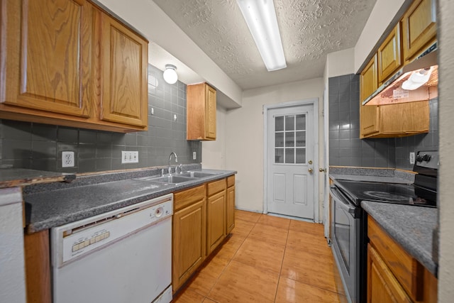 kitchen featuring stainless steel electric stove, tasteful backsplash, sink, white dishwasher, and a textured ceiling