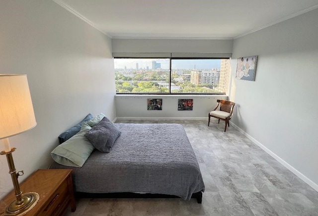 bedroom with crown molding, baseboards, and a city view