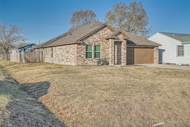 view of front of home with a garage and a front yard