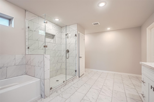 bathroom with vanity and plus walk in shower