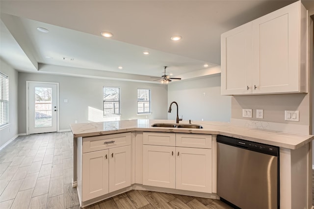 kitchen with sink, stainless steel dishwasher, and white cabinets