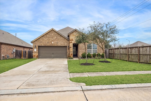 view of front facade with a garage and a front lawn