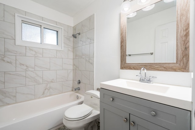 full bathroom with toilet, vanity, and tiled shower / bath combo