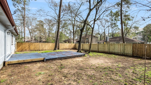 view of yard featuring a wooden deck