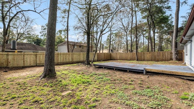 view of yard with a wooden deck