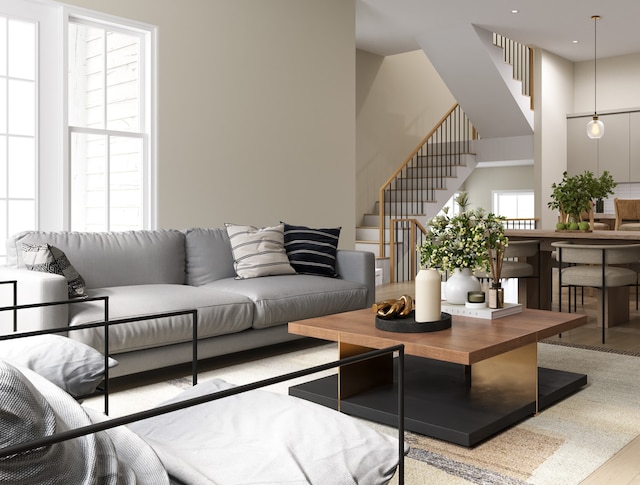 living room featuring a wealth of natural light and light wood-type flooring