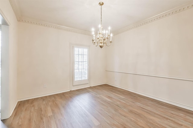 unfurnished room with ornamental molding, a chandelier, and light wood-type flooring