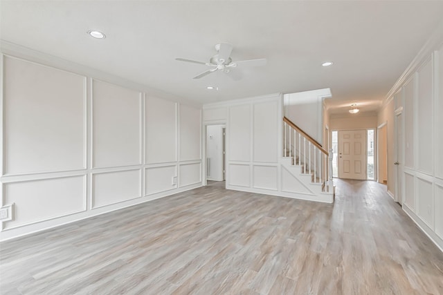 empty room featuring ceiling fan and light wood-type flooring