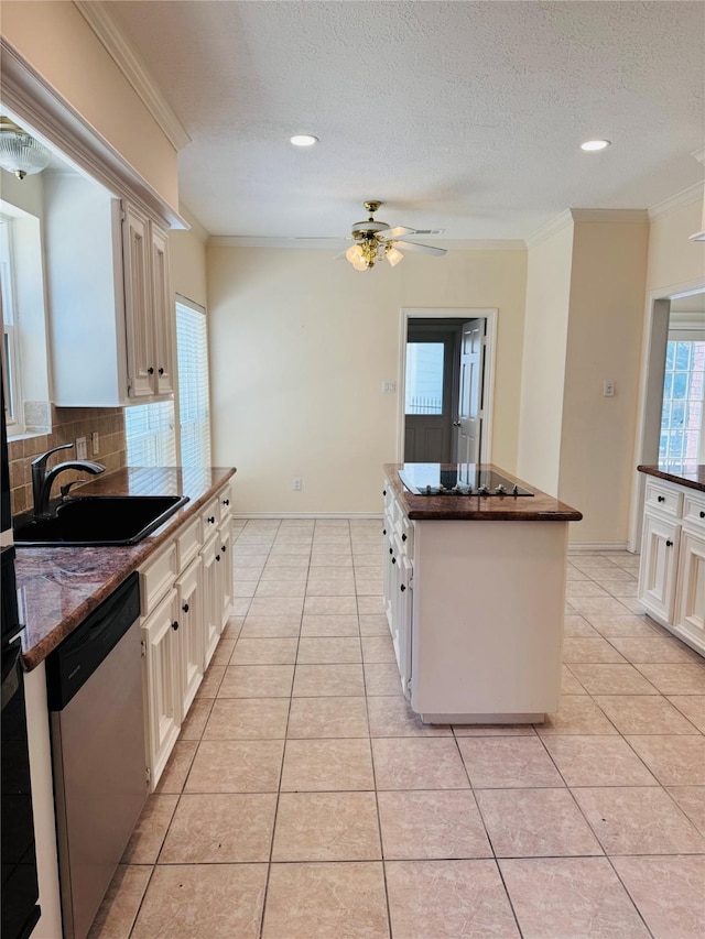 kitchen featuring sink, a center island, dishwasher, black electric stovetop, and white cabinets