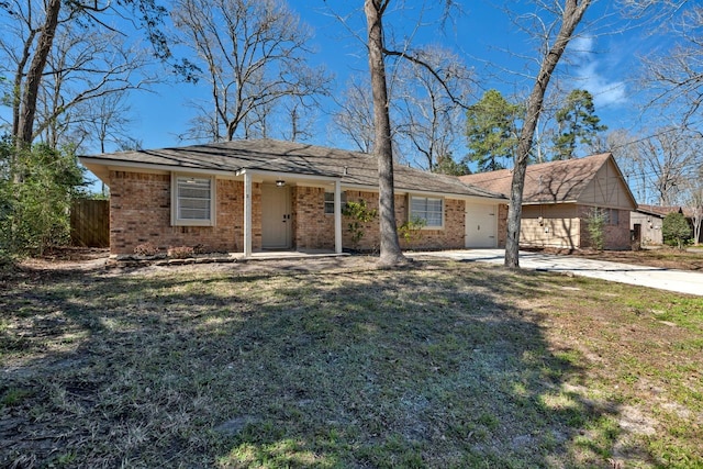 ranch-style home featuring a garage, driveway, fence, a front lawn, and brick siding