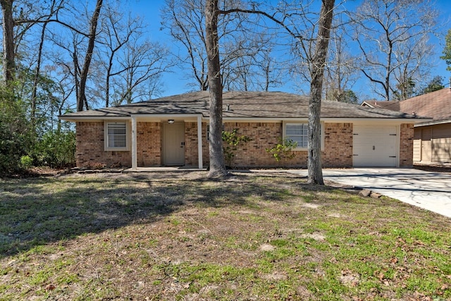 ranch-style house featuring a garage, driveway, brick siding, and a front lawn