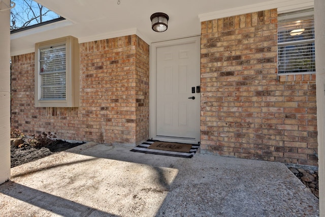 entrance to property with a patio area