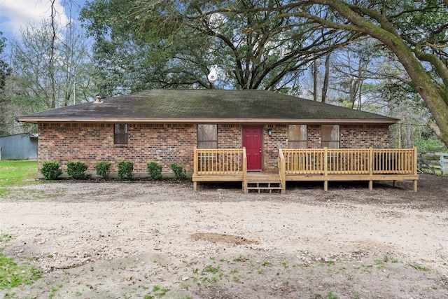 view of front of home featuring a wooden deck