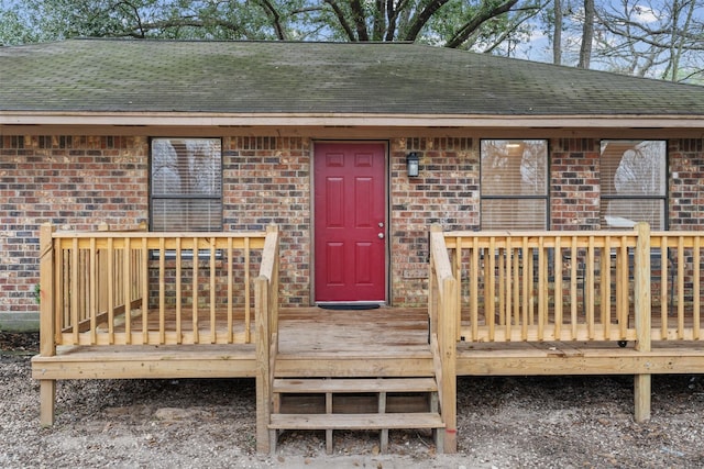 entrance to property featuring a deck