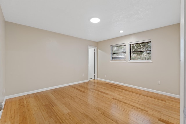 unfurnished room featuring light hardwood / wood-style flooring