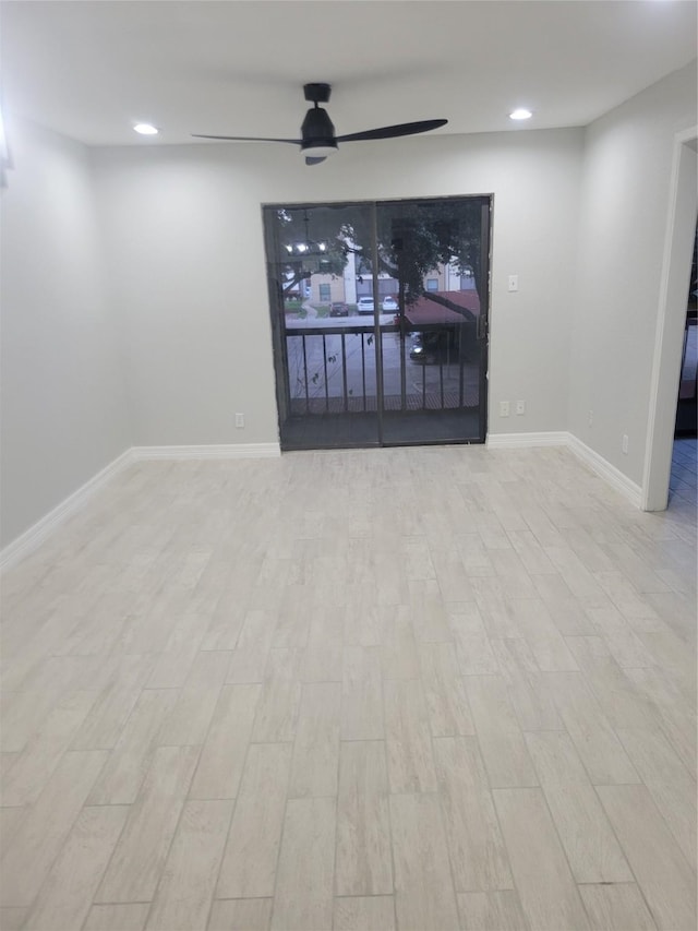 living room featuring ceiling fan and light wood-type flooring