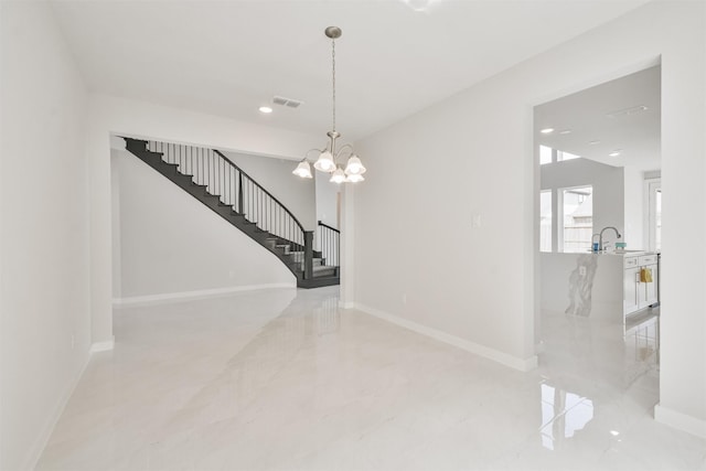 interior space featuring sink and a notable chandelier