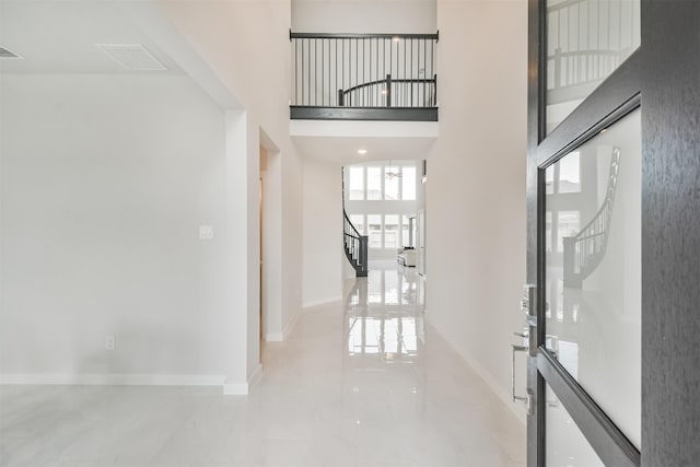 hallway with a towering ceiling