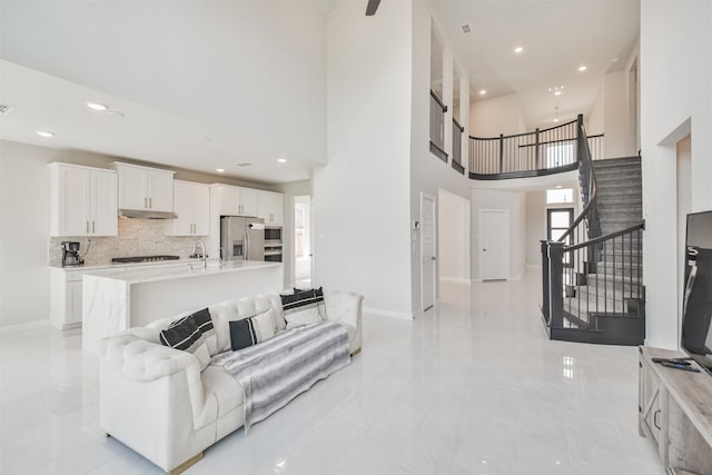 living room with a high ceiling