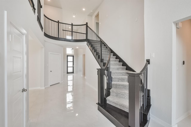 foyer featuring a high ceiling