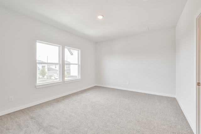 unfurnished room featuring carpet flooring