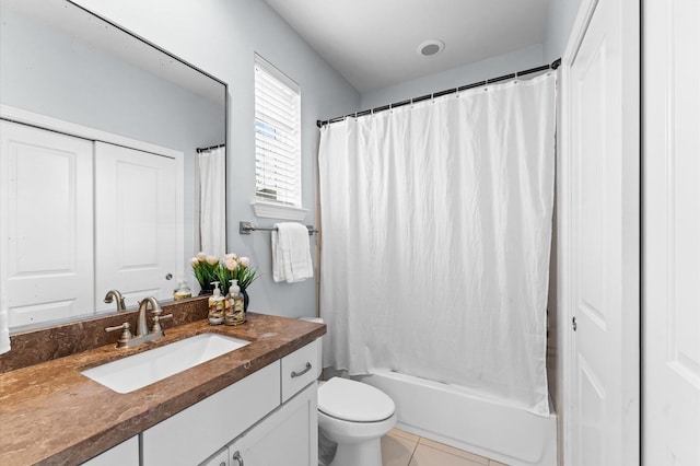 full bathroom featuring tile patterned flooring, vanity, shower / bath combination with curtain, and toilet