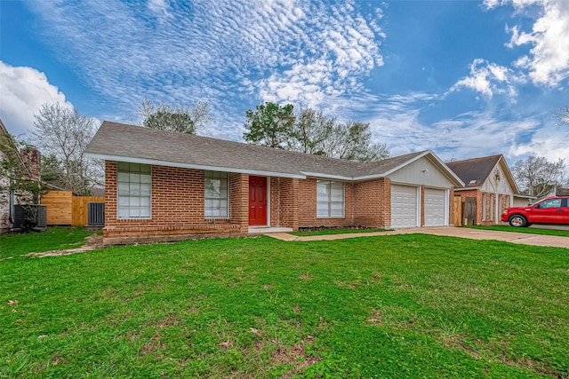 single story home featuring a garage and a front lawn